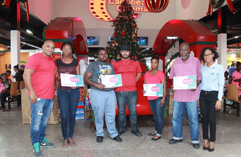 Representatives of four of the eight organisations receiving their vouchers at the Giftland Shopping Centre (Photo courtesy Giftland Office Max)