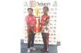 BEI’s skipper national U-19 left-arm spinner Gilbert Griffth (left) and Annadale’s Captain Guyana U-17 all-rounder Joshua Bollers with the championship trophy at the press briefing yesterday (Sean Devers photo)