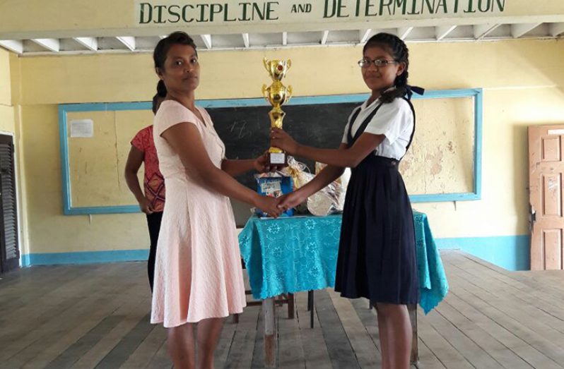 One of the top students receiving a prize at her school’s recent graduation