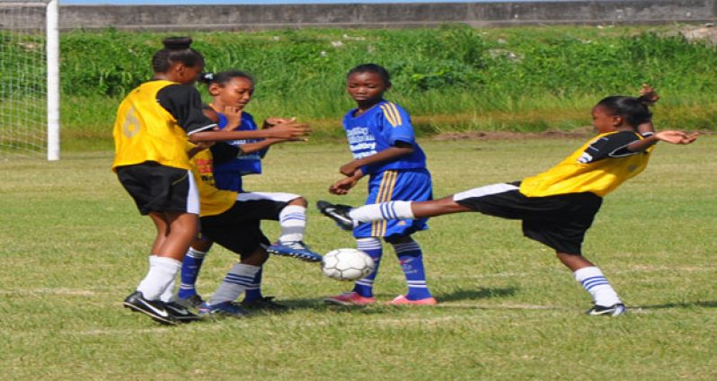 Flashback! Part of the semifinal action between giant-killers St Stephen’s Primary (yellow) and pre-tournament favourites Enterprise Primary which the former won 10-9 on sudden death penalty kicks last Sunday.