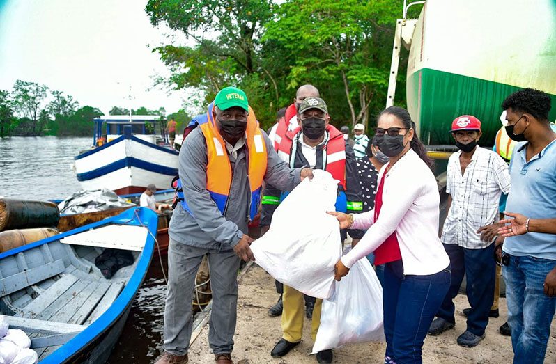 Prime Minister, Mark Phillips, distributing a hamper on Friday (Office of the Prime Minister photo)