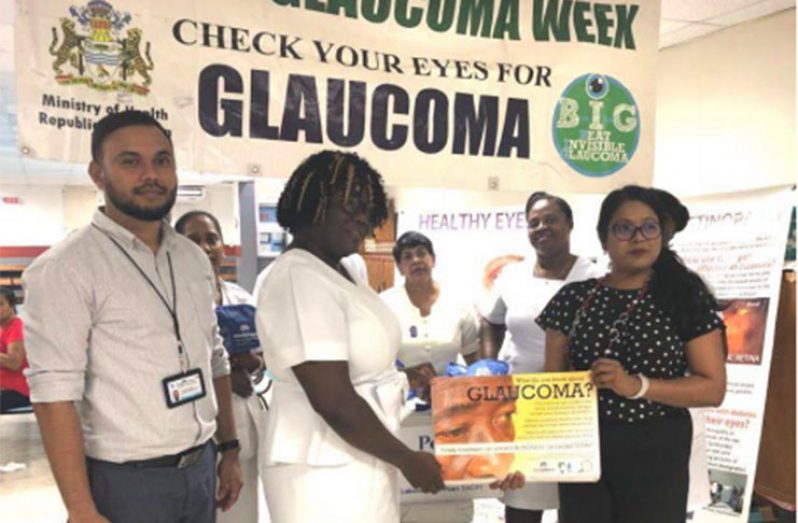 Head of GPHC’s Ophthalmology Department, Dr. Shailendra Sugrim (left) with other officials during the presentation of the posters