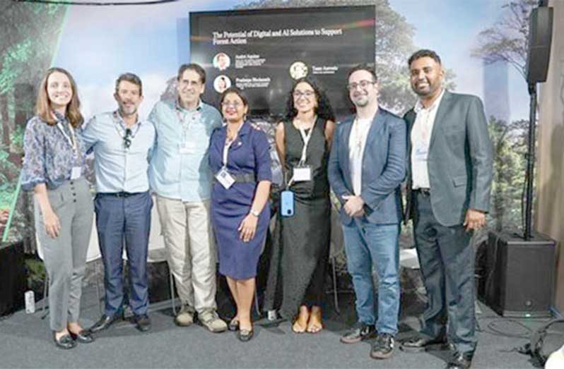 Global experts on forests and artificial intelligence pose with facilitators of the Live Canopy session at COP30 in Belém, Brazil (Yusuf Ali/News Room)