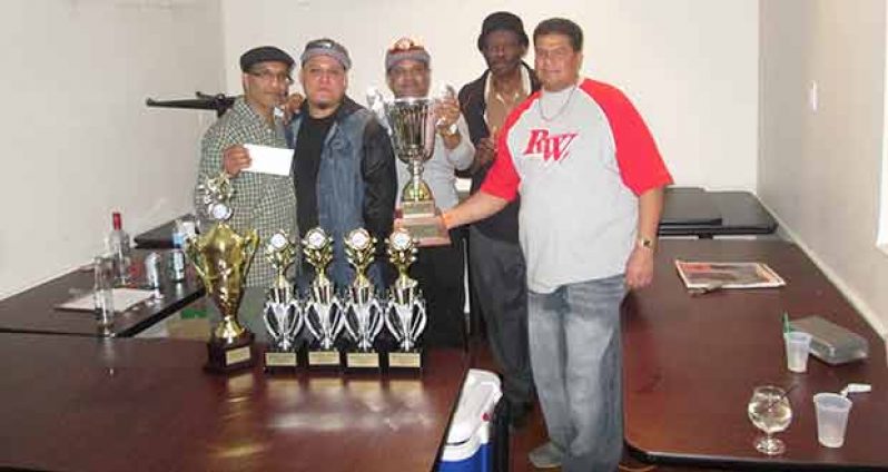 Four of Glory Guys players, including skipper Ryan Chung, pose with their winnings. CDA president and organiser Zakir Khan is at far left.
