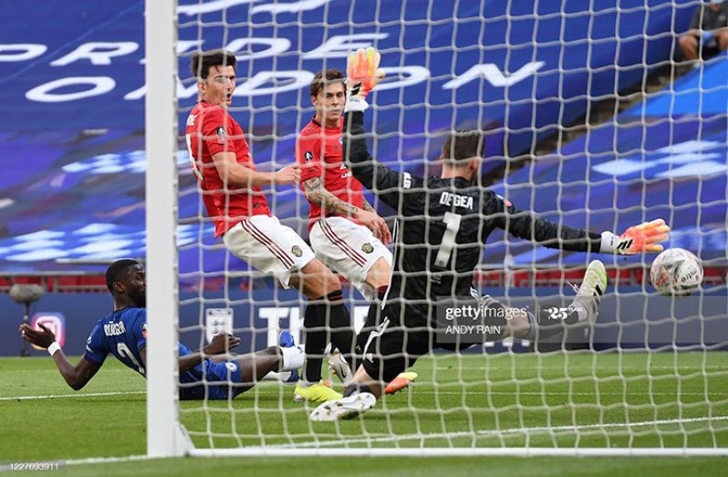 Manchester United's English defender Harry Maguire (2nd L) deflects the ball past Manchester United's Spanish goalkeeper David de Gea (R) into his own net for Chelsea's third goal during the English FA Cup semi-final football match between Manchester United and Chelsea at Wembley Stadium in London, on July 19, 2020. (Photo by Andy Rain / POOL / AFP) /