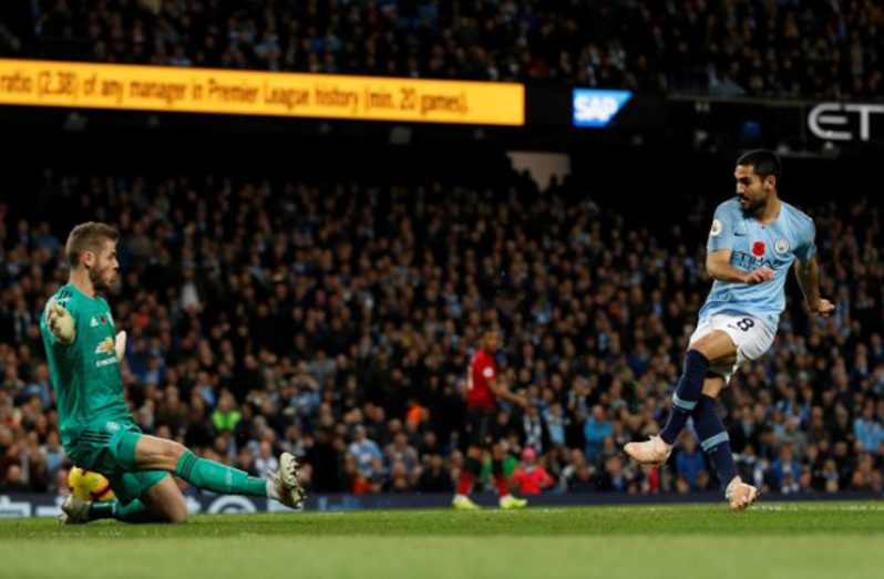 Manchester City's Ilkay Gundogan scores their third goal REUTERS/Darren Staples