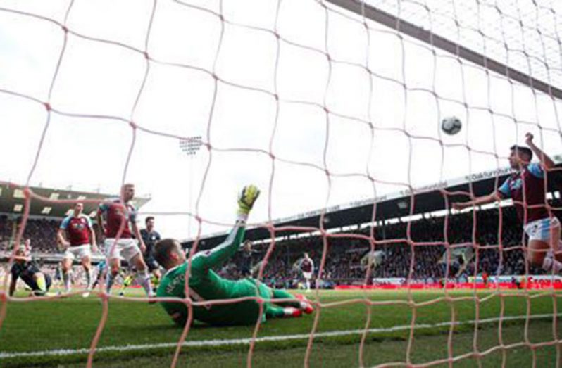 Burnley's Matthew Lowton in action as Manchester City's Sergio Aguero (not pictured) scores their first goal REUTERS/Andrew Yates