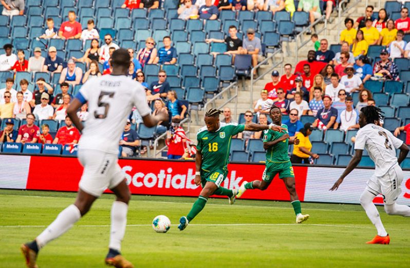 THE GOAL! Neil Danns, caught by Chronicle Sport Samuel Maughn just as he was about to unleash his 'beauty' in the 54th minute to give Guyana a 1 - 0 advantage over Trinidad and Tobago.