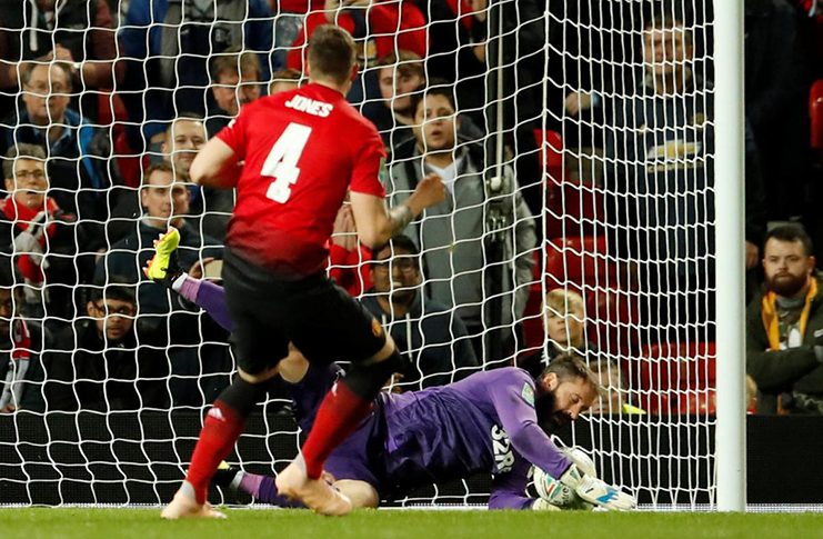 Manchester United's Phil Jones has a penalty saved by Derby County's Scott Carson during the shootout. (Action Images via Reuters/Andrew Boyers)