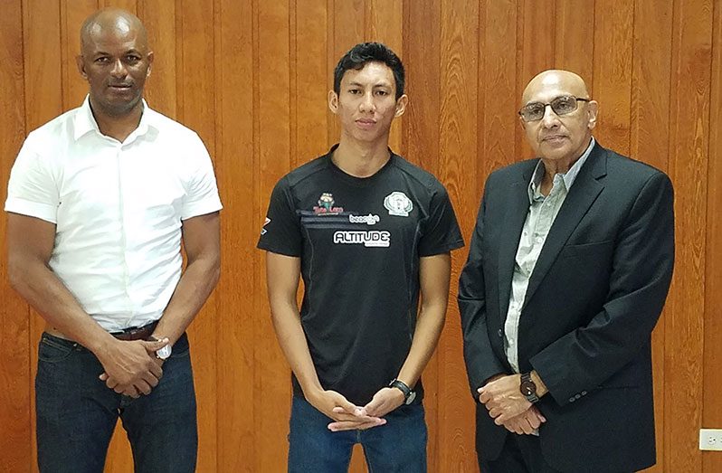 From left: Guyana Table Tennis Association president Godfrey Munroe, Miguel Wong, and Guyana Olympic Association president K.A. Juman-Yassin