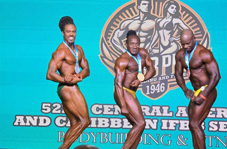 Guyana's gold medal Winner Lindon Burnett (centre) and silver medal winner Rawle Greene (left)