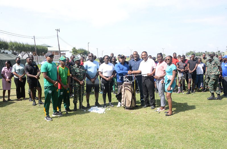 GGA President, Aleem Hussain presents golf gear and equipment to members of the Guyana defence force