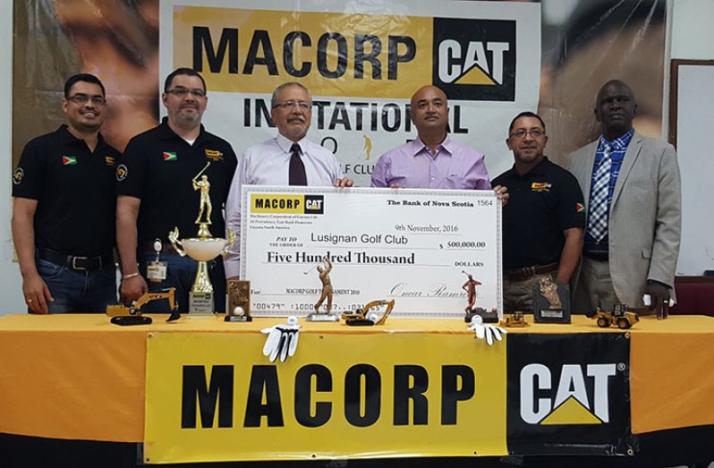 MACORP executives stand with CEO Jorge Medinas (3rd from left) as he hands over the sponsorship cheque to the Lusignan Golf Club president Oncar Ramroop (4th from left).