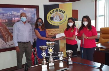 LGC president Patanjilee Persaud (left) stands alongside LGC PRO Anasha Ally who receives the sponsorship cheque from a S. Jagmohan representative in the presence of Project Manager Vidya Mangalram.