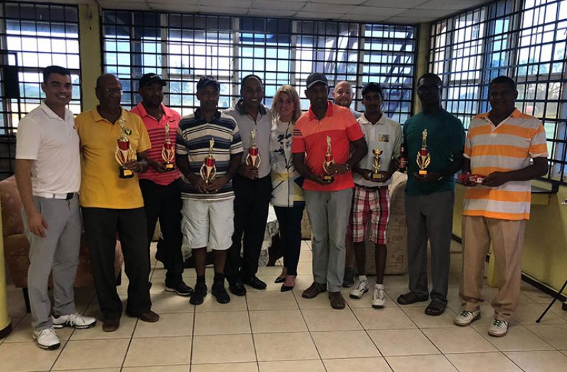 (From left)  Mr Guillermo Escarraga, Maurice Solomon, Parmanand Persaud, Lekhnarine Shivraj, Club President Aleem Hussain, Ms Christina Howlett, Maxim Mangra (partly hidden) Mr Mauro Remiro, Kevin Dinanauth, Gavin Todd, and David Harry.