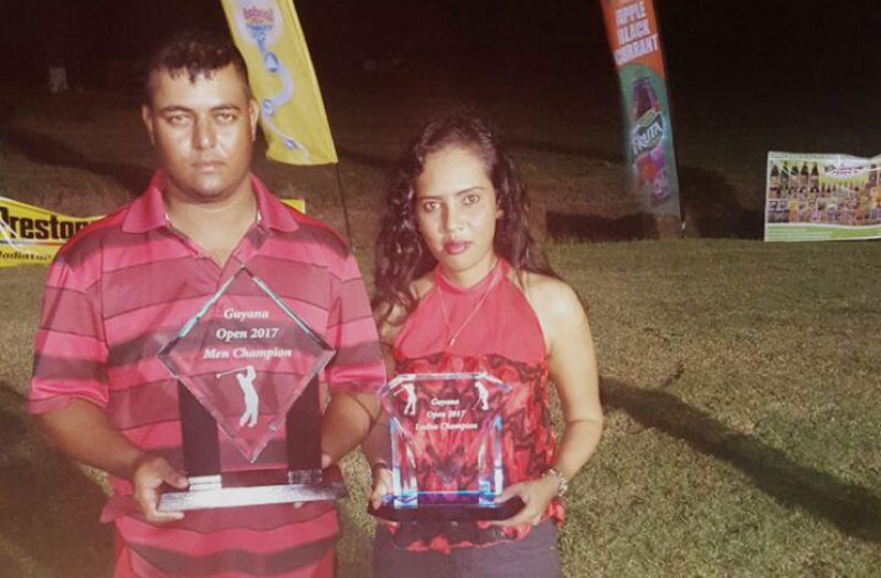 Avinash Persaud and Christine Sukhram pose with their respective Guyana Golf Open 2017 titles. (Rajiv Bisnauth photo)