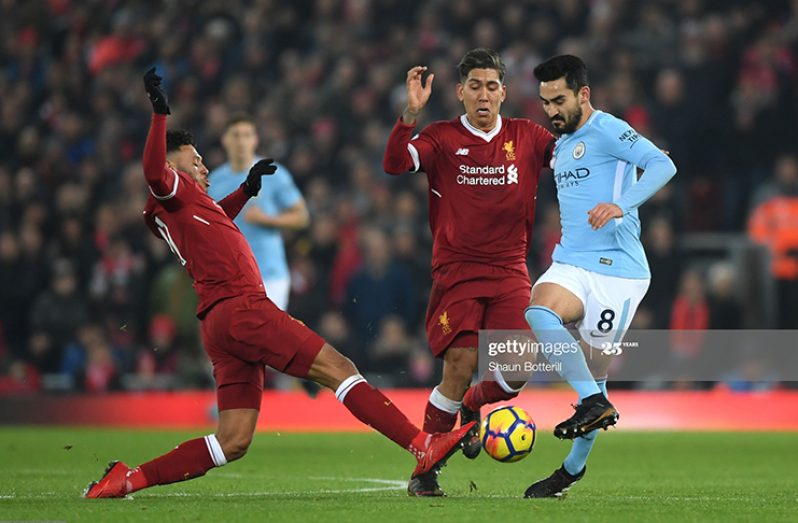 Ilkay Gundogan of Manchester City, Roberto Firmino of Liverpool and Alex Oxlade-Chamberlain of Liverpool in action during the Premier League match between Liverpool and Manchester City at Anfield on January 14, 2018 in Liverpool, England. (Photo by Shaun Botterill/Getty Images)