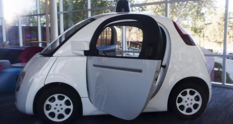 A Google self-driving car is seen inside a lobby at the Google headquarters in Mountain View, California November 13, 2015.