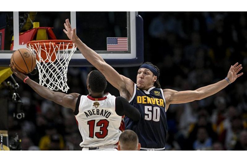 Aaron Gordon tries to block Bam Adebayo's effort.