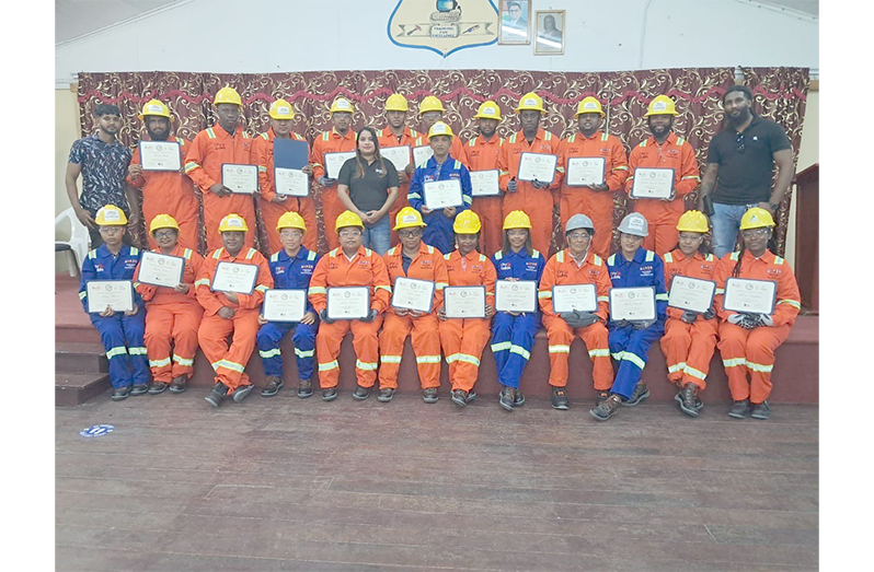 The 23 electrical installation graduates and officials