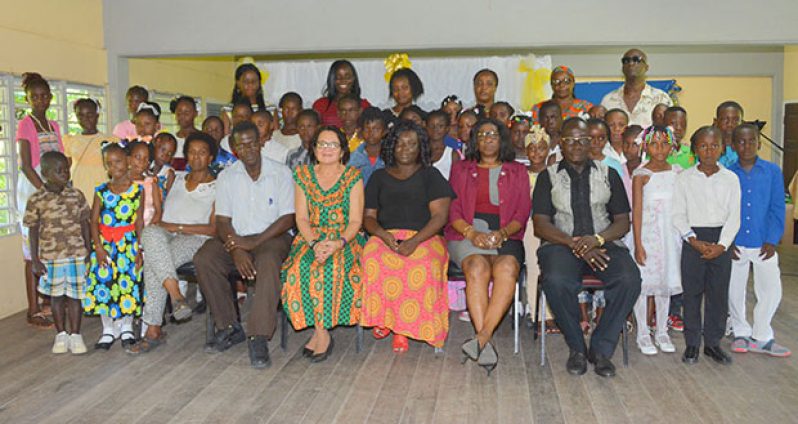 First Lady, Mrs Sandra Granger, and facilitators, pose with the graduates from the ICT Training Programme