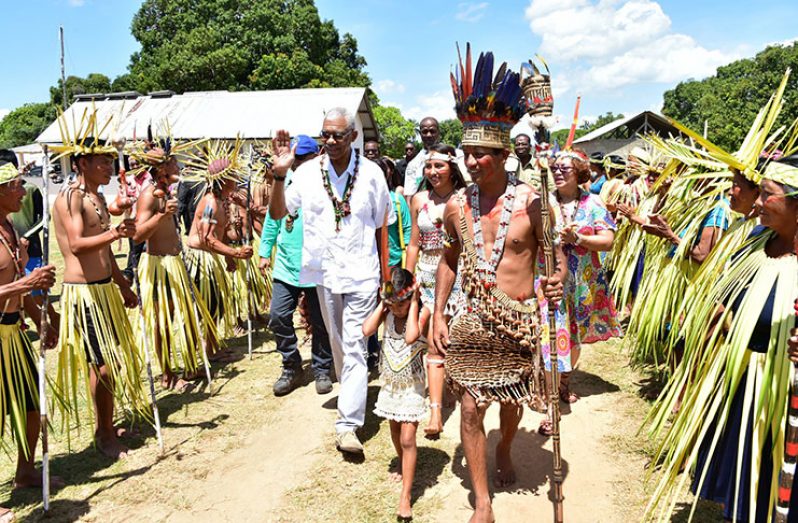 President David Granger receives a warm welcome from residents of Shulinab Village, Upper Takutu-Upper Essequibo in 2018 upon his arrival in the village