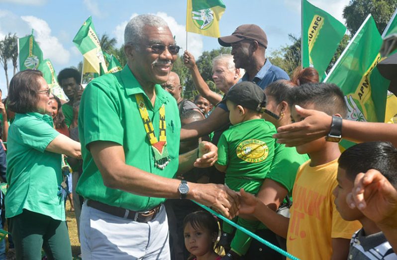 President David Granger and First Lady Sandra Granger being greeted by supporters on arrival at the Mabaruma Settlement Ground on Wednesday.