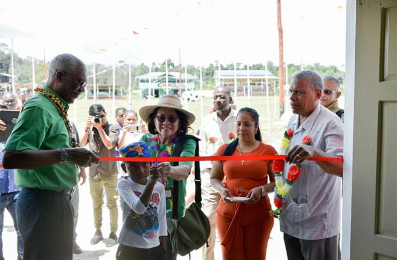 President David Granger and First lady Sandra Granger in the company of Regional Chairman Mr Gordon Bradford witness the cutting of the ribbon opening the Jawalla Sports Center. Also pictured is Regional Executive Officer Mr Kerwin Ward — atJawalla Village, Upper Mazaruni .