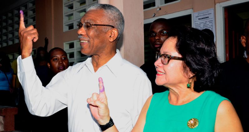 President David Granger and First Lady Sandra Granger showcase their inked index fingers after voting at the Enterprise Primary School, Durban Backlands