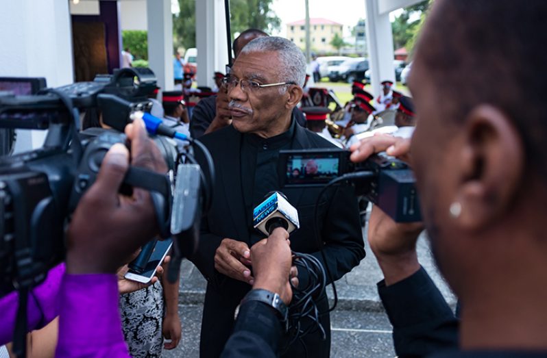 President David Granger speaking with members of the media in Monday at the Place of Heroes in the Botanical Gardens (Photo by Delano Williams)