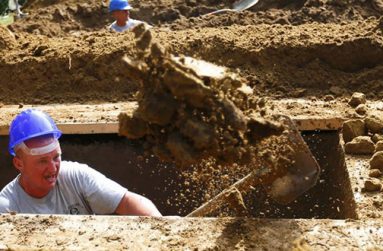 A gravedigger takes part in the first Hungarian grave digging championship in Debrecen, Hungary, June 3, 2016, competing for the national crown, which is awarded based on accuracy, speed, and aesthetic quality. (REUTERS/Laszlo Balogh)