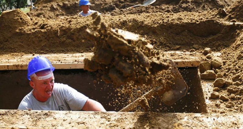 A gravedigger takes part in the first Hungarian grave digging championship in Debrecen, Hungary, June 3, 2016, competing for the national crown, which is awarded based on accuracy, speed, and aesthetic quality. (REUTERS/Laszlo Balogh)