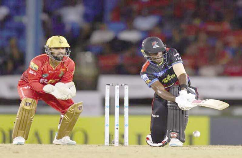 Justin Greaves of the Antigua & Barbuda Falcons sweeps during his topscore of 46 against the Trinbago Knight Riders