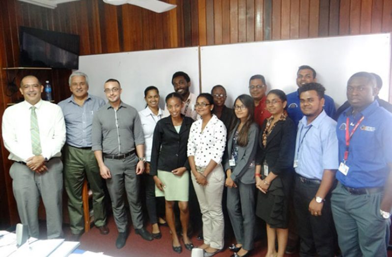 Trainers and trainees at the bio-inputs programme are, from left: Mr. Wilmot Garnett, IICA local representative; IICA specialists Mr. Pedro Cussianovich and Mr. Mario Van Stahlen, and PTCCB and NAREI agricultural technicians