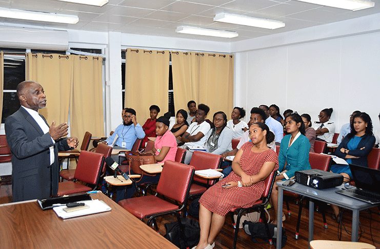 File Photo: University of Guyana law students pay keen attention to Foreign Secretary, Carl Greenidge, as he lectured on the Guyana-Venezuela controversy (Adrian Narine Photo)