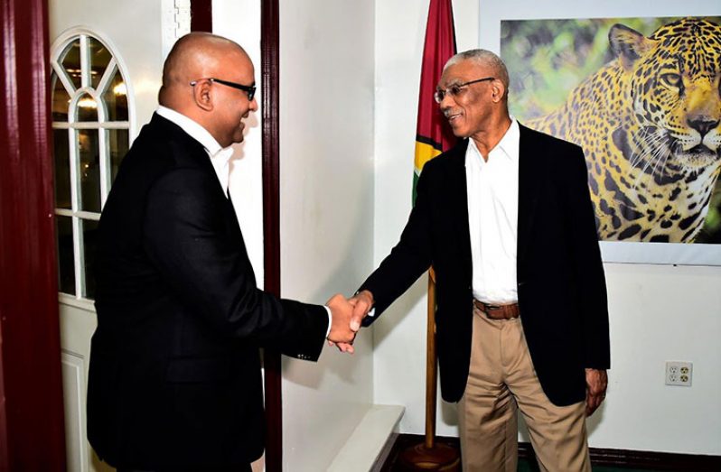 President David Granger greets Leader of the Opposition, Bharrat Jagdeo upon his arrival at State House