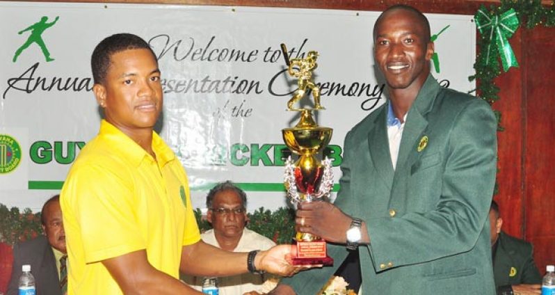 Flashback! Well done, Leon: GCB Senior Chairman of Selectors Rayon Griffith (right) presents Senior Cricketer-of-the-Year Leon Johnson with his trophy at the Awards ceremony held two weeks ago. (Photo by Cullen Bess-Nelson)