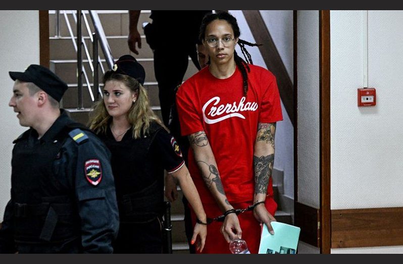 Brittney Griner was handcuffed and wearing a red T-shirt as she was led into the court in Khimki outside Moscow