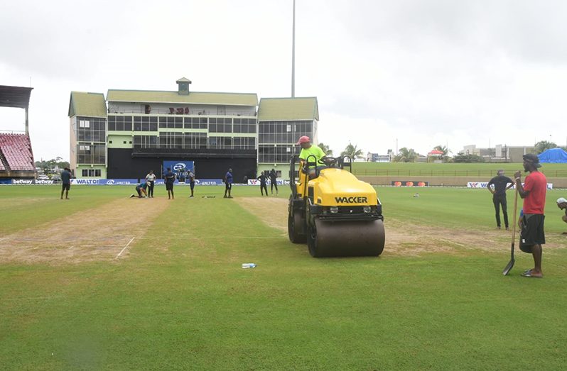 Ground staff preparing the pitch and outfield ahead of today's first ODI at the Guyana National Stadium, Providence (Adrian Narine photos)
