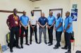 Umpire Chandraban Rajnarine (centre) was the first to benefit from the programme