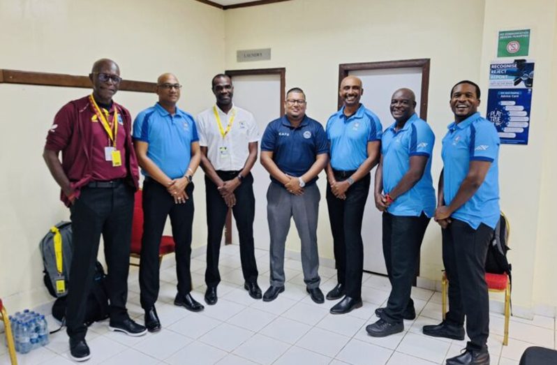 Umpire Chandraban Rajnarine (centre) was the first to benefit from the programme