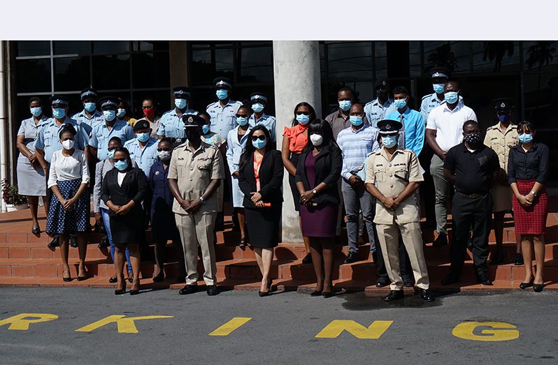 Minister of Human Services and Social Security, Dr. Vindhya Persaud (third from left), flanked by Police Commissioner (ag), Nigel Hoppie, and participants of the training course