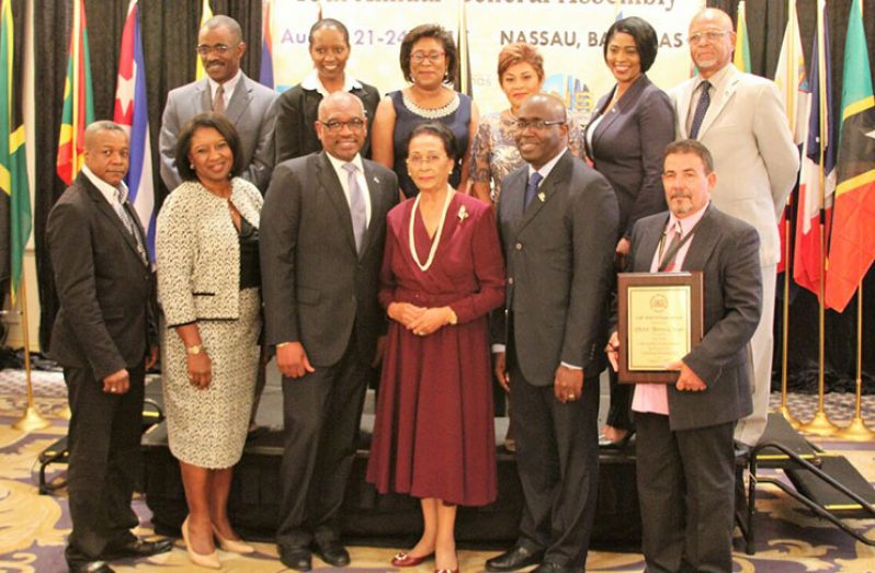 Minister Hughes (back row, third from left) stands with other officials at the CBU’s annual general meeting