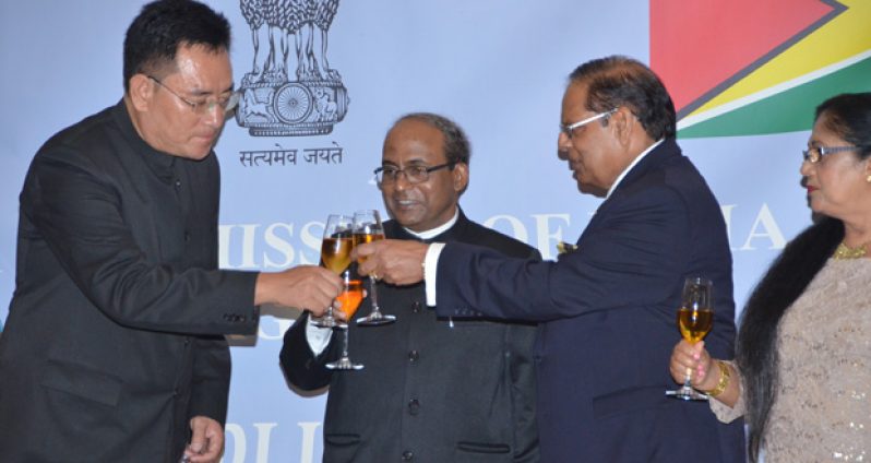 Prime Minister Moses Nagamootoo and India High Commissioner to Guyana Venkatachalam Mahalingam and another member of the Diplomatic Corps toasting to India’s Republican status