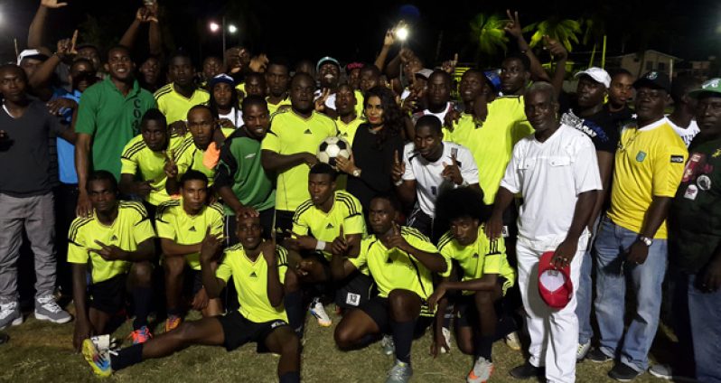 Picture shows at right, GT Beer Brand Manager Jeoffrey Clement and second right Ms. Shondel Easton with the Winners Connection team celebrating after their win