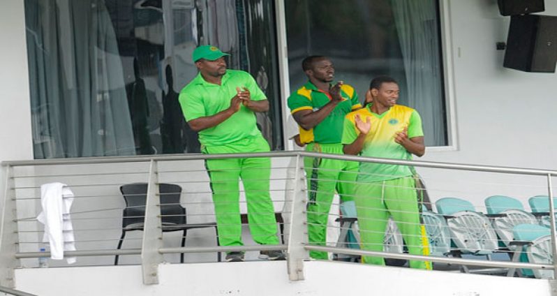 Well done, guys! Guyana Jaguars’ head coach Esaun Crandon (left), manager/assistant coach Rayon Griffith and fast bowler Ronsford Beaton applaud the team following their four-wicket win over Barbados Pride last Monday. (Photo courtesy WICB Media)