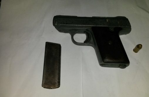 The unlicensed .32 pistol with two live matching rounds that were found