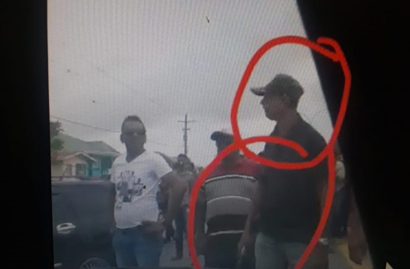 This man was seen with what appeared to be a handgun during one of the protests on Friday