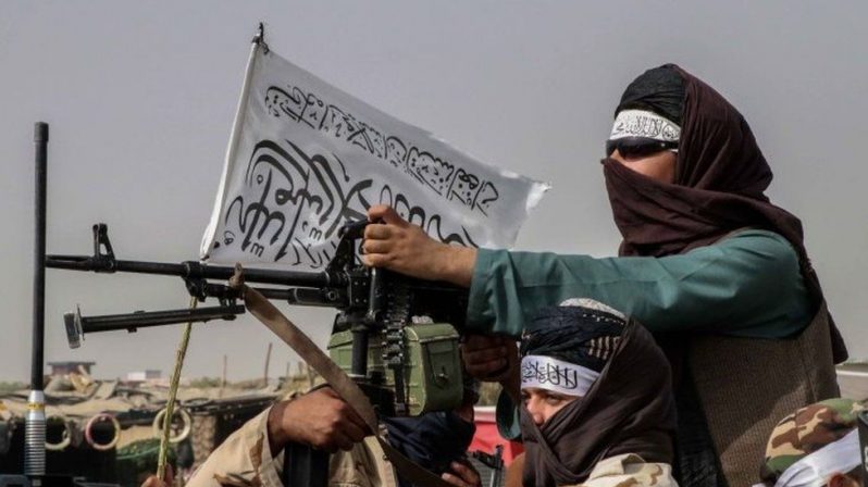 Taliban fighters with heavy weapons have been patrolling the streets of Afghan cities (BBC photo)