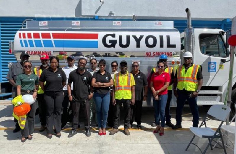 General Manager, Molly Hassan (fourth from left) along with staff in front of one of the new freightliner trucks